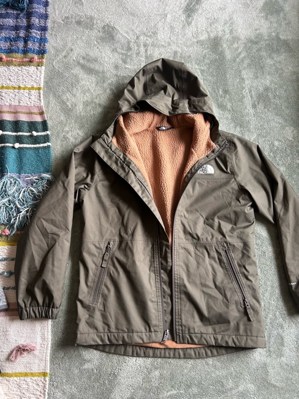 The North Face Kids Olive Green Hooded Raincoat with Tan Fleece Lining
